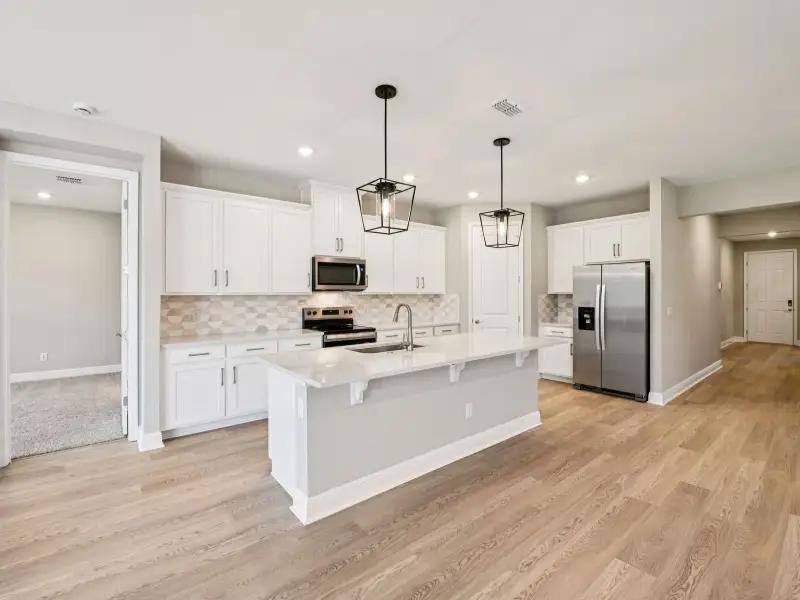 Furnished interior view inside a new home in Ridgehaven - Signature Series, Ormond Beach (Image 3).