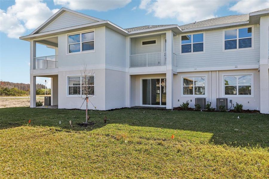 Exterior details and patio area of a home in Lagoon Residences at Epperson, Wesley Chapel (Image 22).
