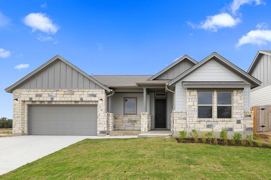 Front exterior of a new home in Sage Hollow, Kyle, TX, highlighting curb appeal (Image 18). Front exterior of a new home in Sage Hollow, Kyle, TX, highlighting curb appeal (Image 18).