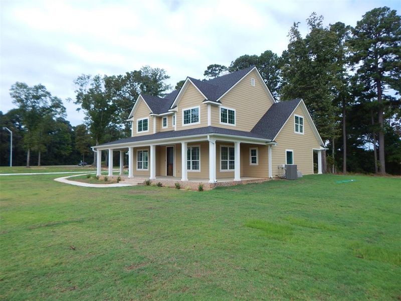 Front exterior of a new home in , Gilmer, TX, highlighting curb appeal (Image 25). Front exterior of a new home in , Gilmer, TX, highlighting curb appeal (Image 25).