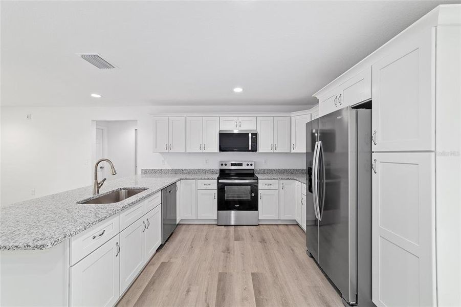 Furnished interior view inside a new home in , Dunnellon (Image 7).