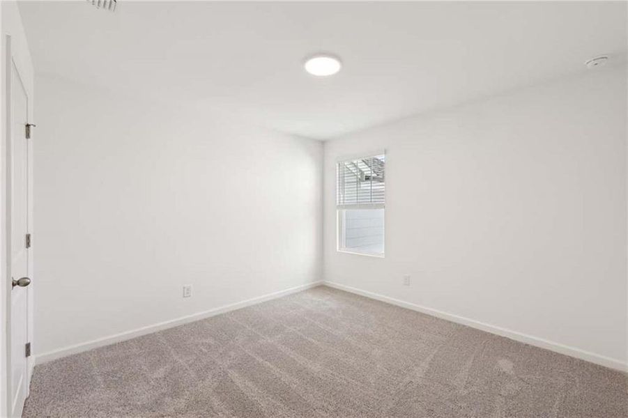 Spacious, unfurnished interior of a new home in Eastlyn Crossing, Flowery Branch (Image 13).