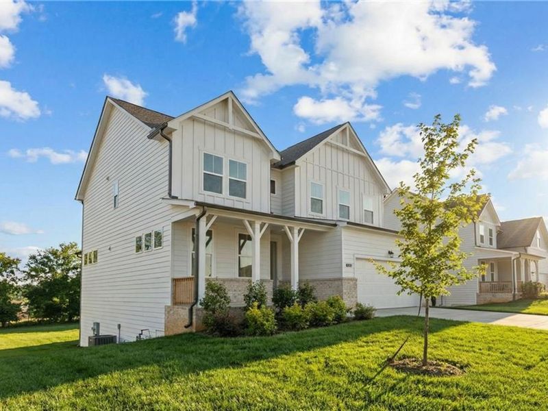 Front exterior of a new home in Wehunt Meadows, Hoschton, GA, highlighting curb appeal (Image 17).