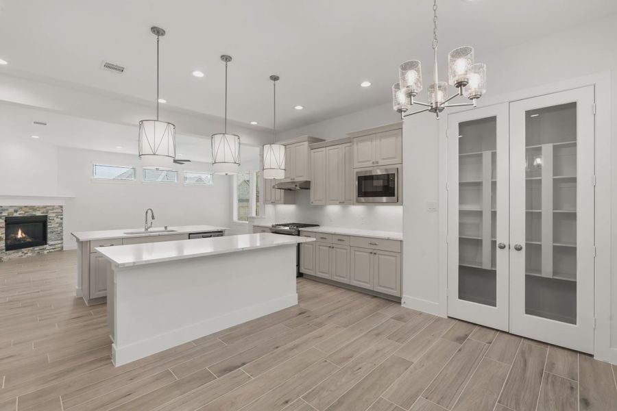 Representative furnished interior of a home built from the Macalister by Chesmar Homes in Artavia, Conroe (Image 5).