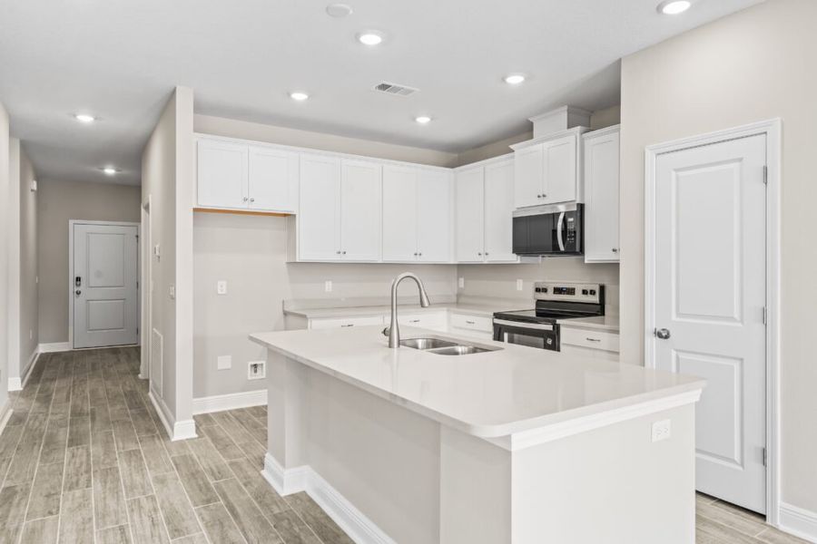 Furnished interior view inside a new home in Natureview, Freeport (Image 10).