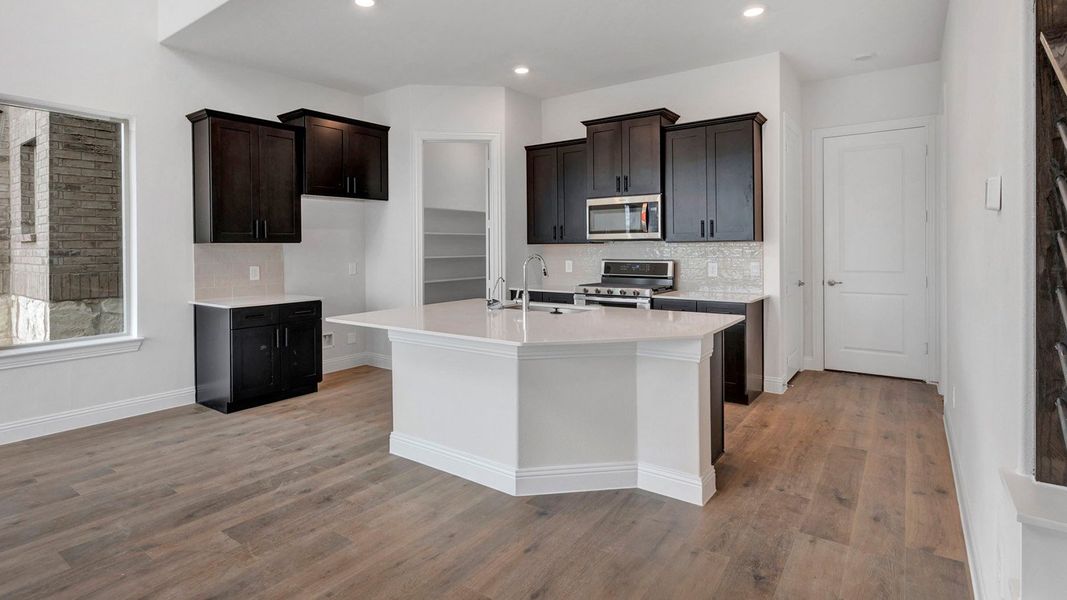 Representative furnished interior of a home built from the Derby by D.R. Horton in Mustang Square, Plano (Image 6).