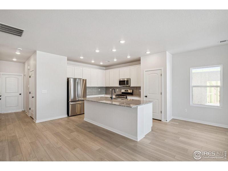 Furnished interior view inside a new home in Kinston Mainstreet Townhomes, Loveland (Image 11).