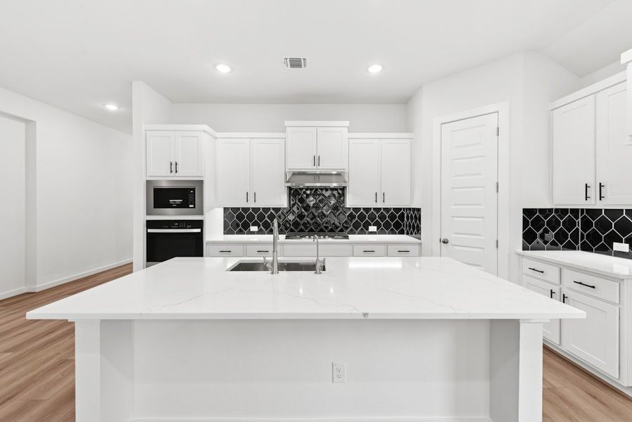 Furnished interior view inside a new home in University Heights, Round Rock (Image 8).