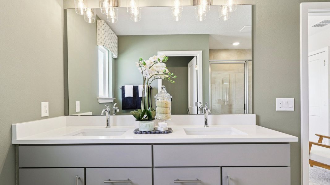 The Mangrove Model Primary Bath with Dual Sinks at Lakeside at Satilla by DRB Homes in Saint Cloud, FL