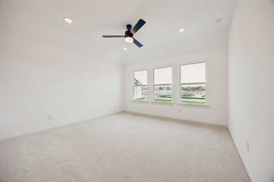 High ceilings, plush carpeting, a wall of windows and luxurious en suite bath create an owner's suite that you will never want to leave!