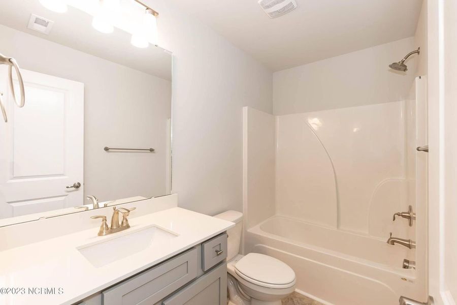 Representative furnished interior of a home built from the 3105 by Adams Homes in Parkland Place, Pace (Image 8).