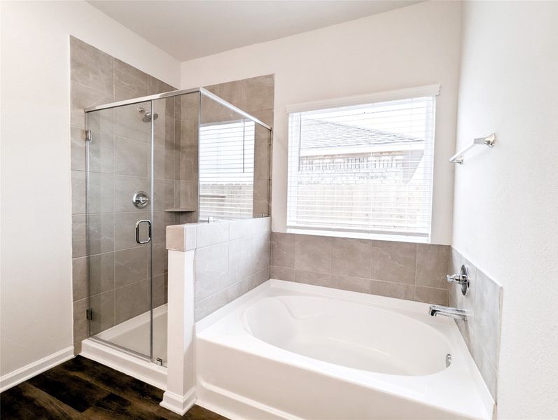 Master bath has separate shower and soaking tub