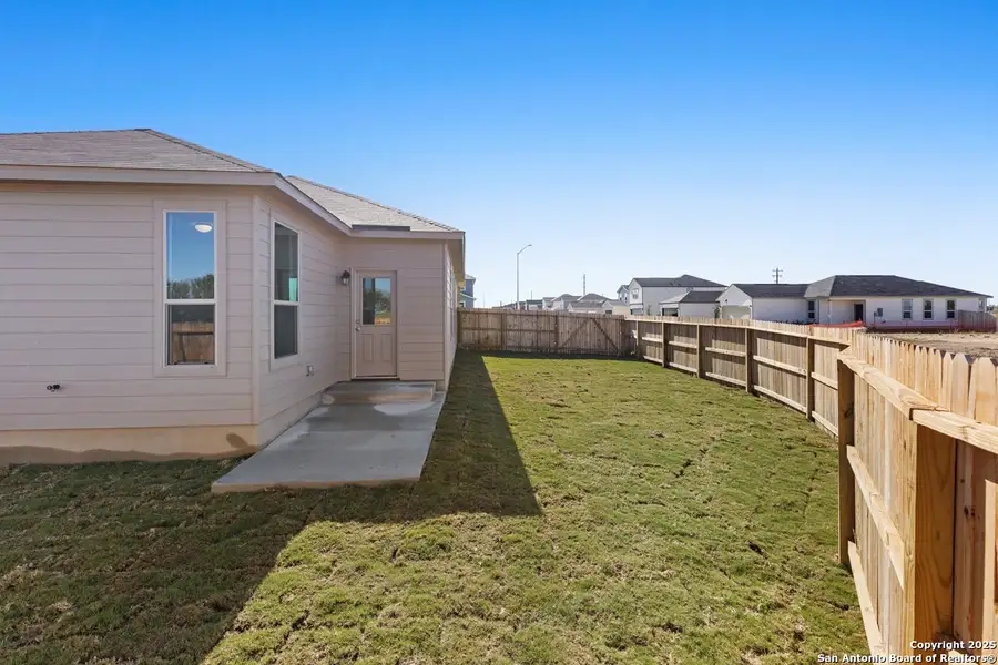 Exterior details and patio area of a home in Woodside Farms, Seguin (Image 2).