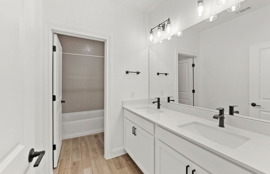 Furnished interior view inside a new home in West Cypress Hills, Spicewood (Image 12).