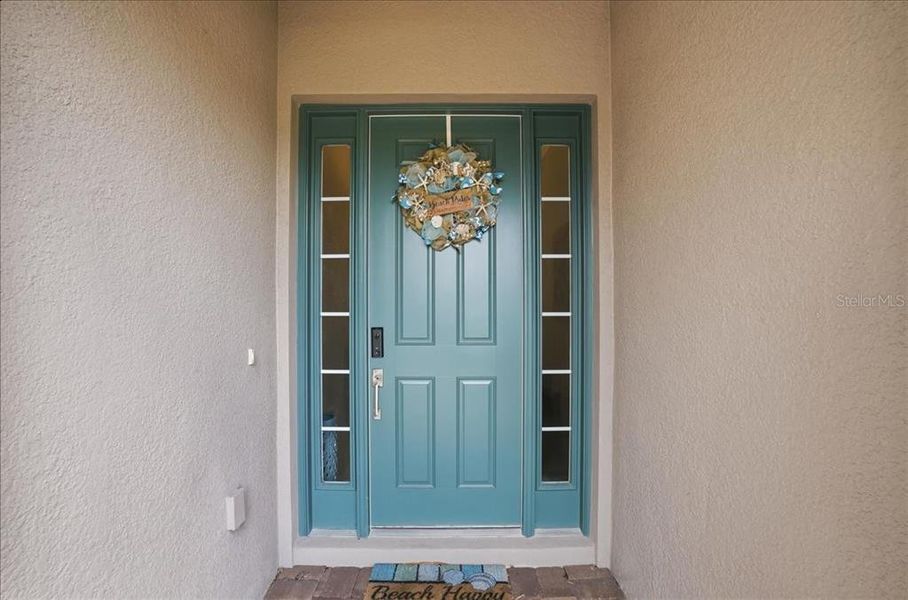 Exterior details and patio area of a home in Esplanade at Artisan Lakes, Palmetto (Image 26).