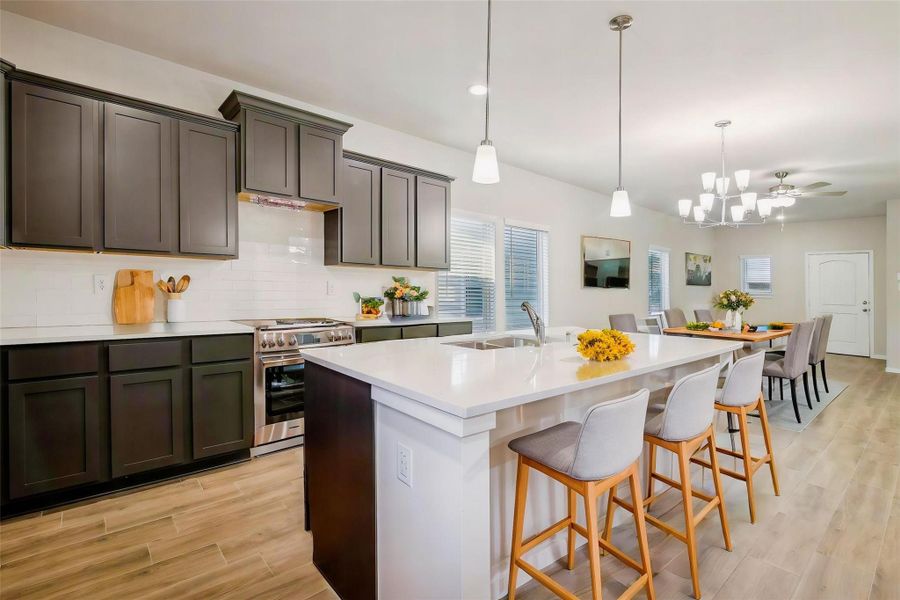 The gorgeous lighting fixtures above offer a great ambiance to the flow of the home.