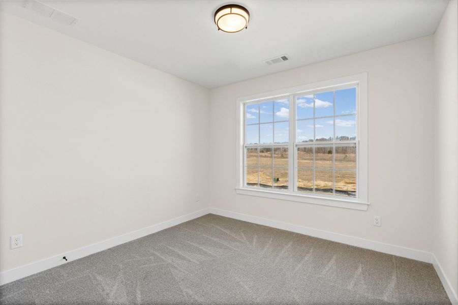 Empty room featuring baseboards and carpet floors Empty room featuring baseboards and carpet floors