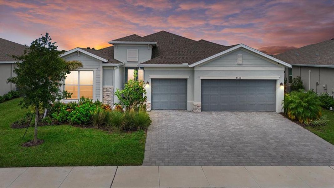 Front exterior of a new home in , Englewood, FL, highlighting curb appeal (Image 1).