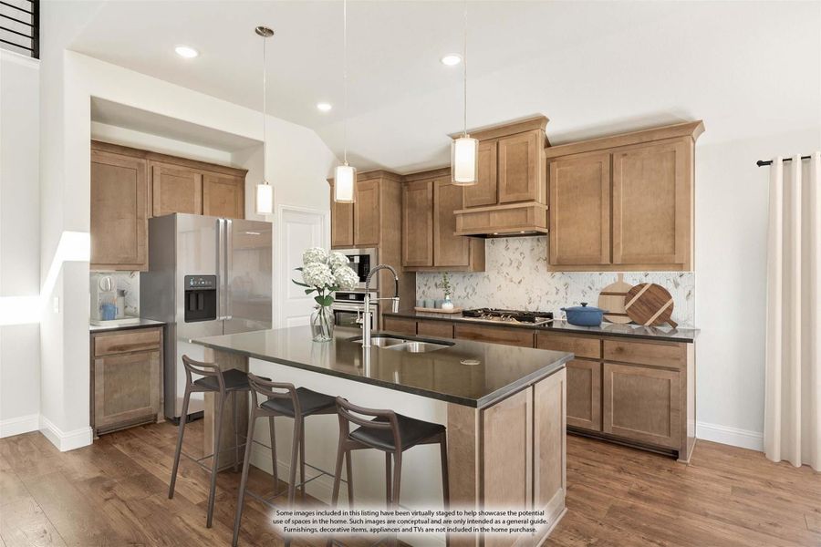 Kitchen with wood cabinets, center island with seating, dark countertops, and stainless steel appliances on hardwood floors Kitchen with wood cabinets, center island with seating, dark countertops, and stainless steel appliances on hardwood floors