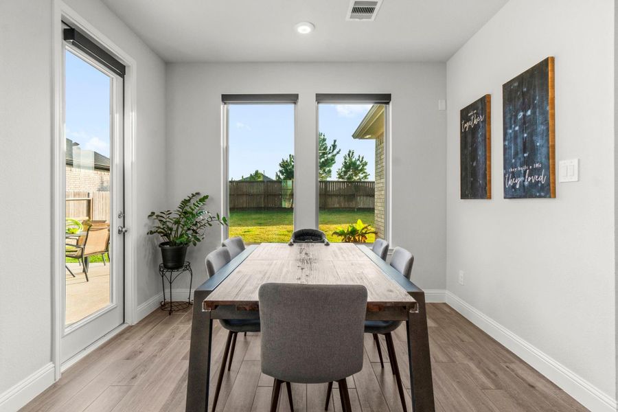 Bright & airy Breakfast nook complimented with large windows.