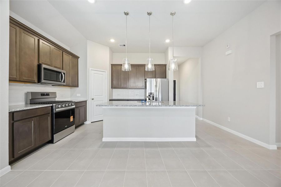 Furnished interior view inside a new home in Sunterra, Katy (Image 6).