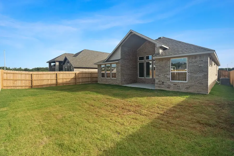 Exterior details and patio area of a home in Lariat, Liberty Hill (Image 3).