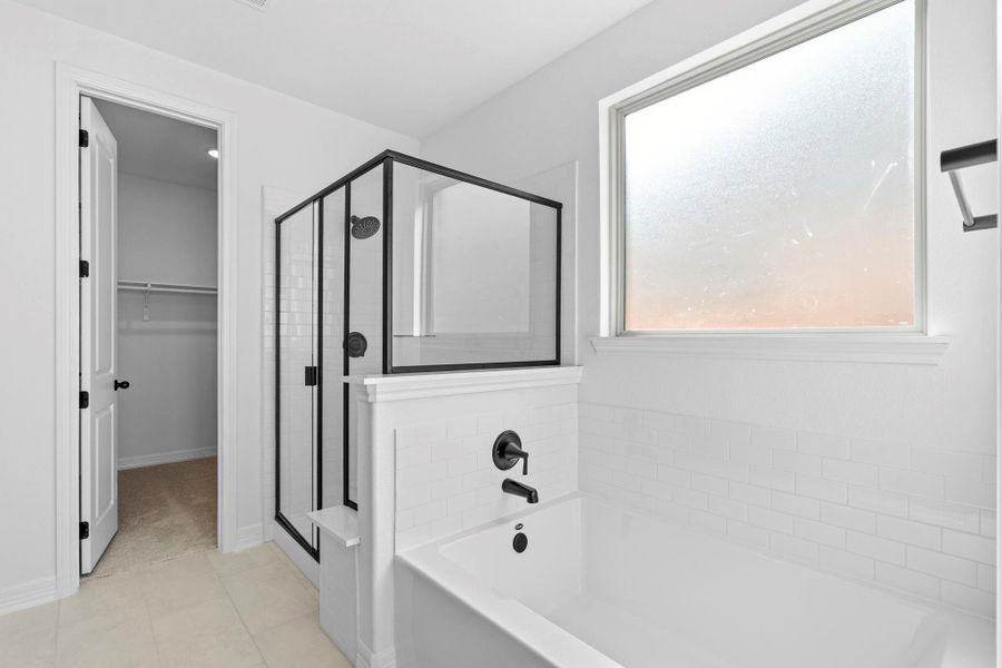 Additional view of the luxurious primary bath featuring a soaking tub and walk-in shower—perfect for relaxing.