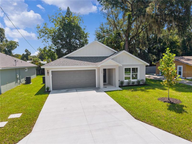 Front exterior of a new home in , Ocklawaha, FL, highlighting curb appeal (Image 23).
