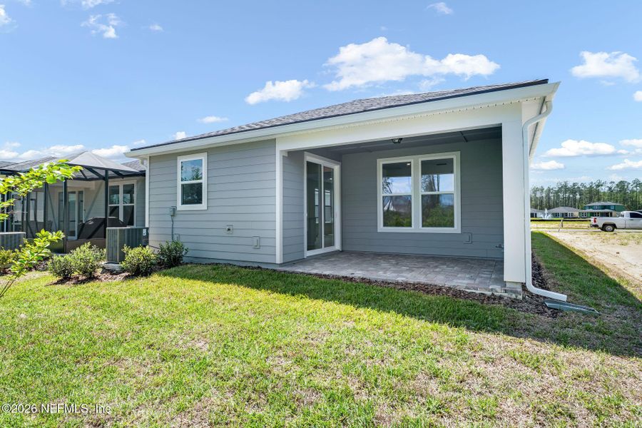 Exterior details and patio area of a home in Del Webb Wildlight, Yulee (Image 27).