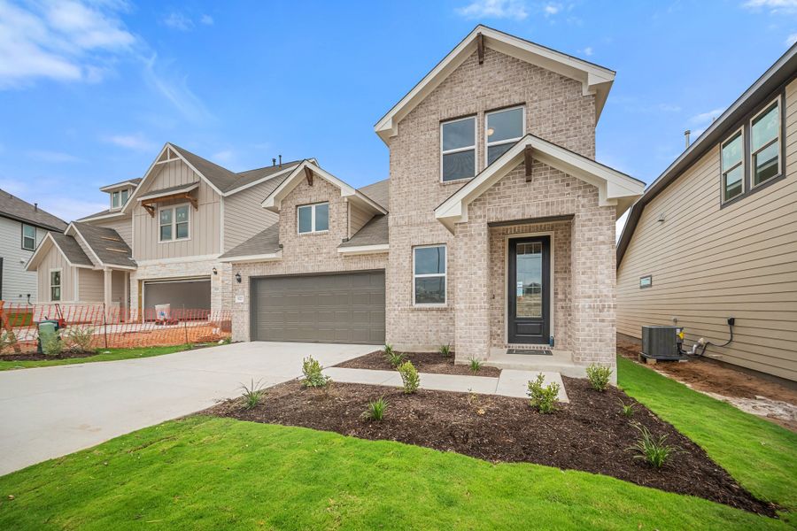 Representative exterior photo of a completed home built from the Sierra by Ashton Woods in Berry Creek Highlands, Georgetown, TX (Image 2).