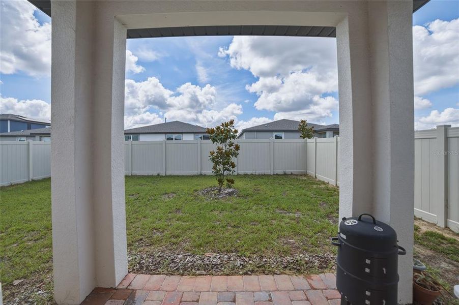 Exterior details and patio area of a home in Springs at Lake Alfred - Classic Series, Lake Alfred (Image 4).