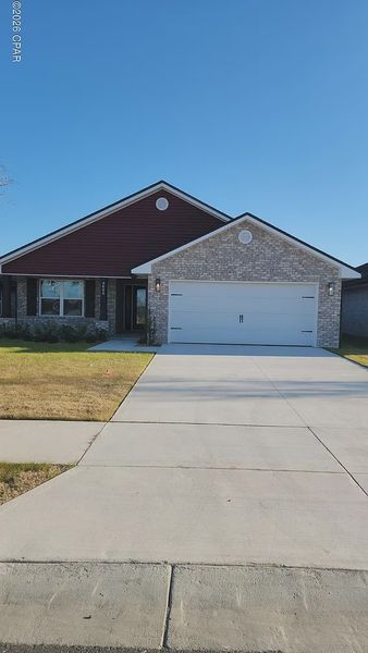 Front exterior of a new home in College Station, Panama City, FL, highlighting curb appeal (Image 1). Front exterior of a new home in College Station, Panama City, FL, highlighting curb appeal (Image 1).
