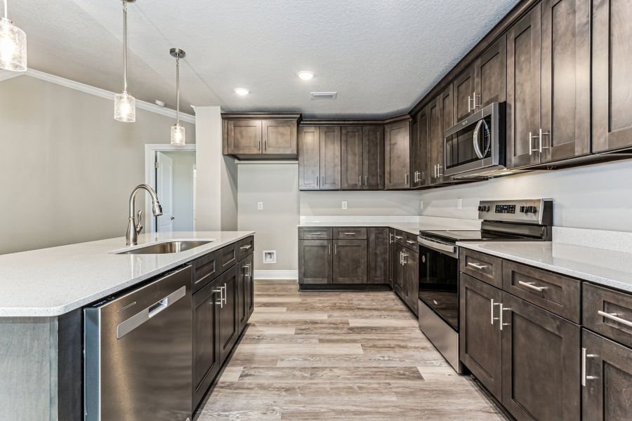 Representative furnished interior of a home built from the The Liberty by Herbst Homes in Clear Water Landing, Milton (Image 17).