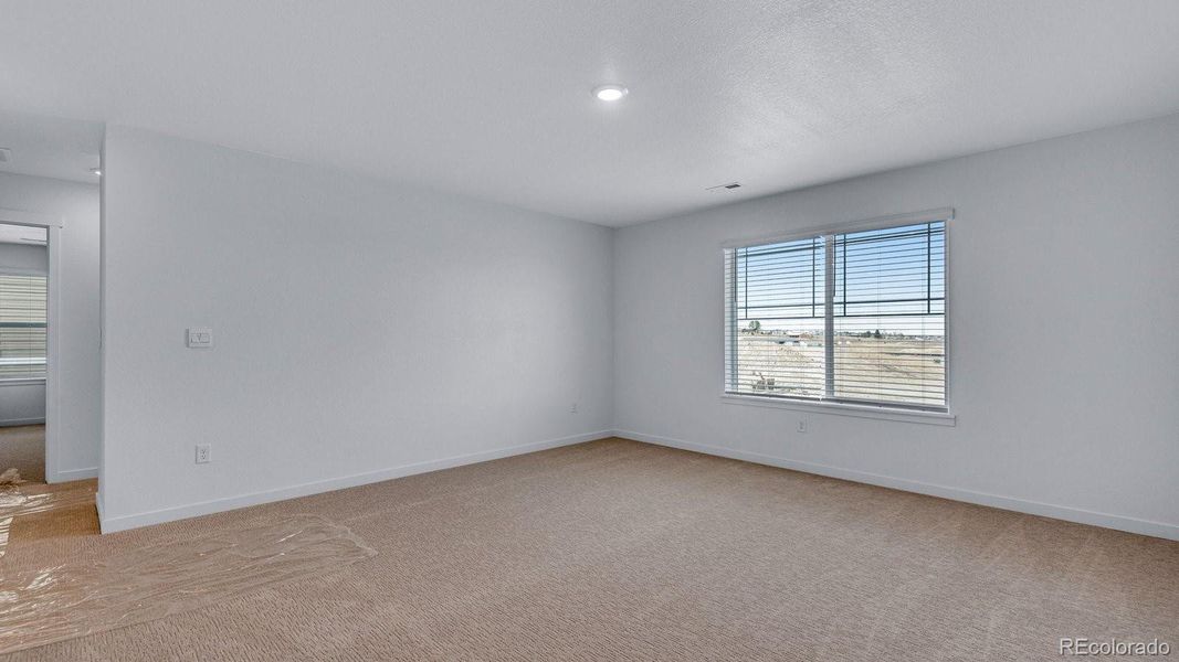 Spacious, unfurnished interior of a new home in Trails at Crowfoot, Parker (Image 29).