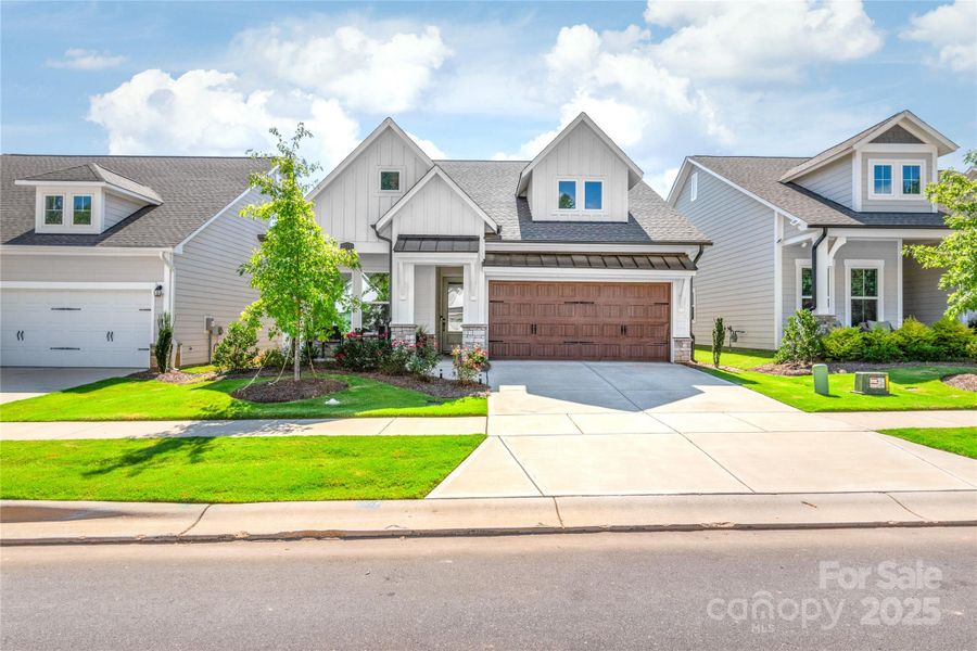 Front exterior of a new home in , Waxhaw, NC, highlighting curb appeal (Image 19).