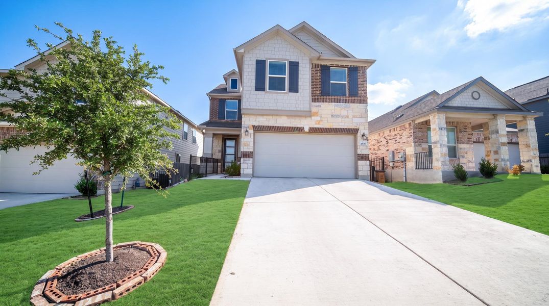 A well-maintained lawn and extended driveway welcome visitors to this charming two-story residence. A well-maintained lawn and extended driveway welcome visitors to this charming two-story residence.