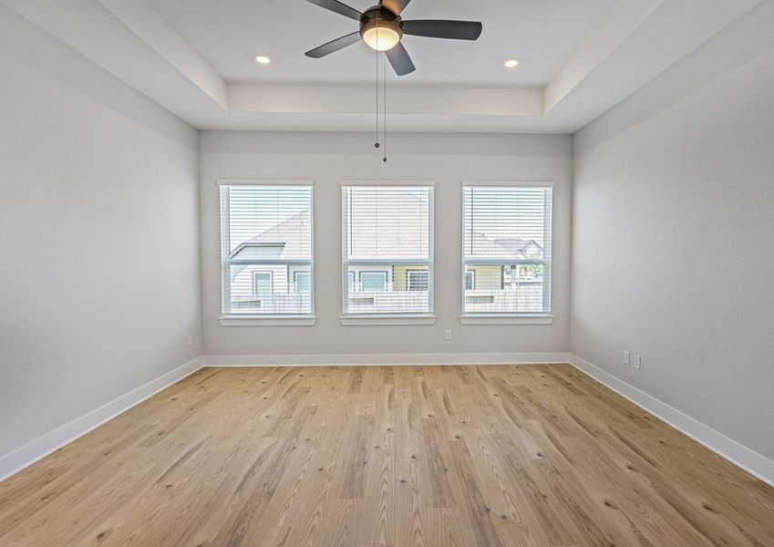 The master bedroom is spacious and has three large windows. The master bedroom is spacious and has three large windows.