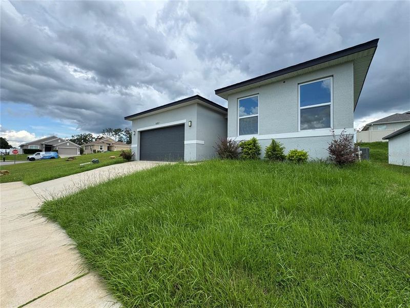 Front exterior of a new home in , Ocala, FL, highlighting curb appeal (Image 1).