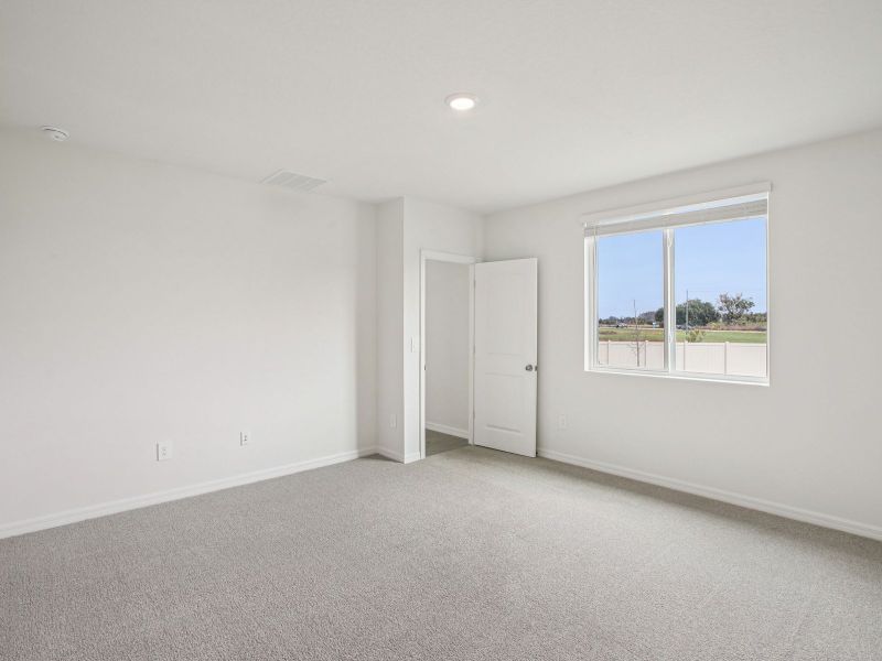 Spacious, unfurnished interior of a new home in The Grove at Stuart Crossing - Classic Series, Bartow (Image 11).