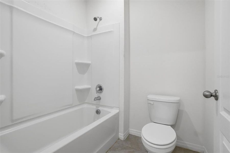 Furnished interior view inside a new home in Poinciana Enclave, Kissimmee (Image 7).