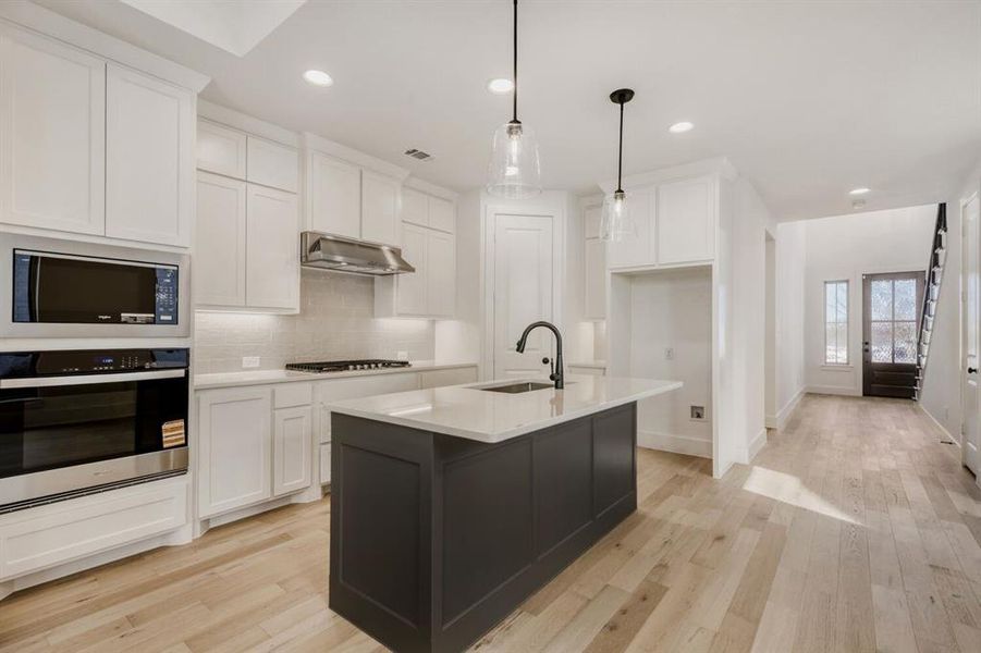 Furnished interior view inside a new home in Castle Hills Northpointe - Townhomes, Lewisville (Image 5).