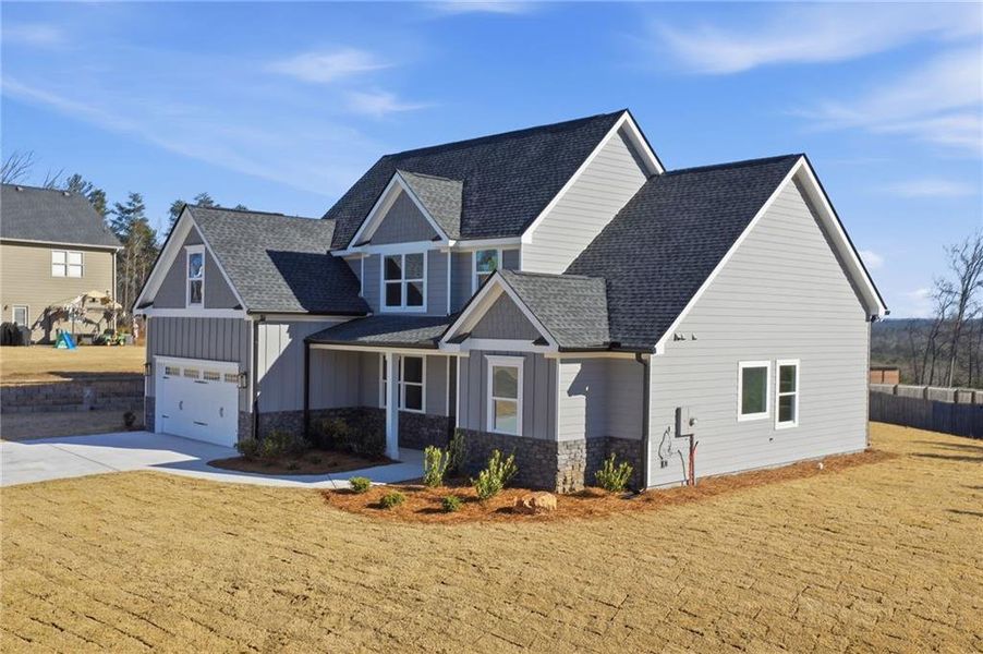 Front exterior of a new home in , Ball Ground, GA, highlighting curb appeal (Image 23).