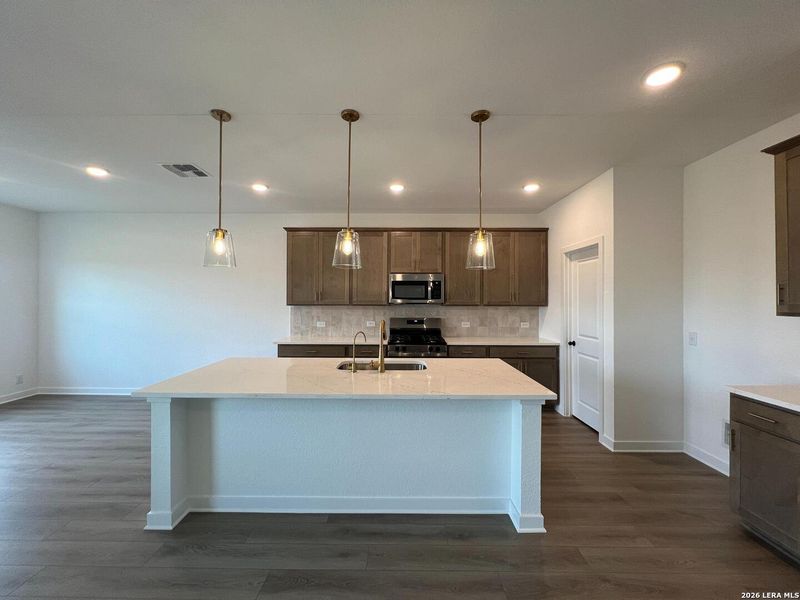 Furnished interior view inside a new home in Nopal Valley, San Antonio (Image 14).