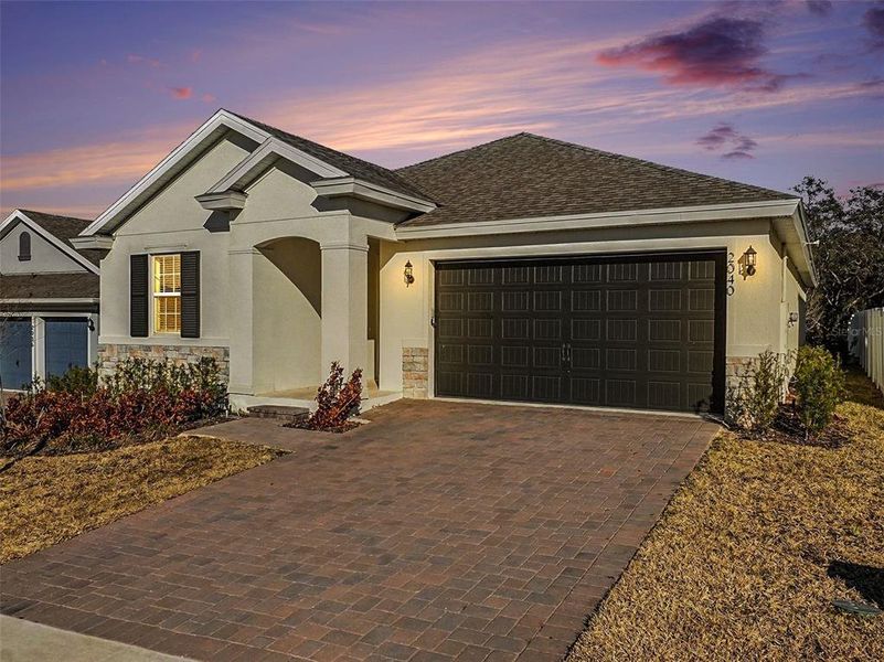 Front exterior of a new home in Hills of Minneola, Minneola, FL, highlighting curb appeal (Image 25). Front exterior of a new home in Hills of Minneola, Minneola, FL, highlighting curb appeal (Image 25).