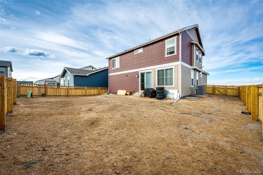 Exterior details and patio area of a home in Painted Prairie, Aurora (Image 3).