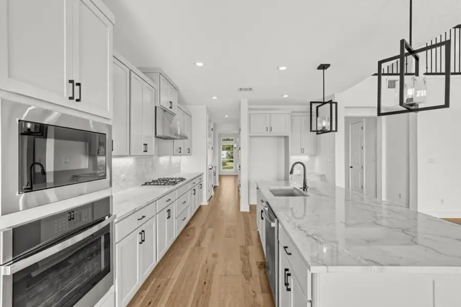 Furnished interior view inside a new home in Travisso, Leander (Image 8).