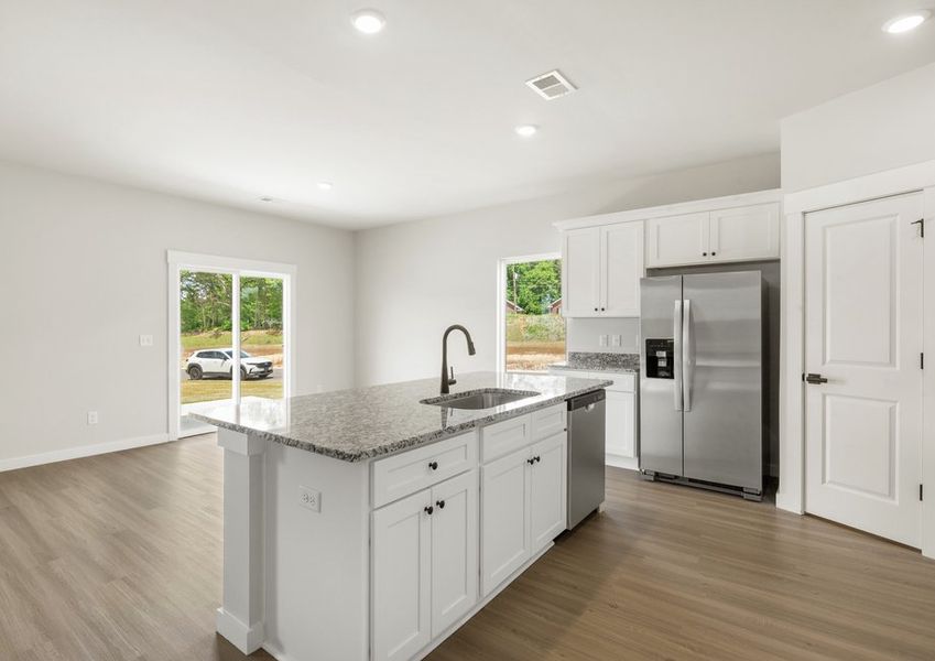 The kitchen overlooks the dining area