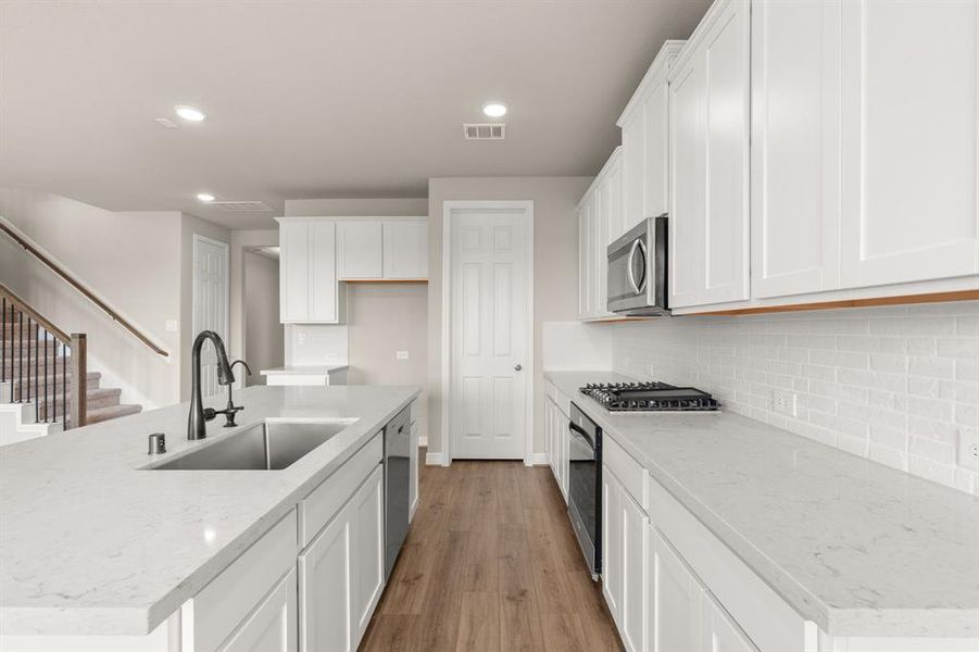 This kitchen is not only a functional space but also has ample storage. Whether you're a seasoned chef or just love to gather and enjoy good food, this kitchen is a dream come true.