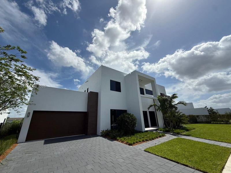 Front exterior of a new home in , Weston, FL, highlighting curb appeal (Image 14).