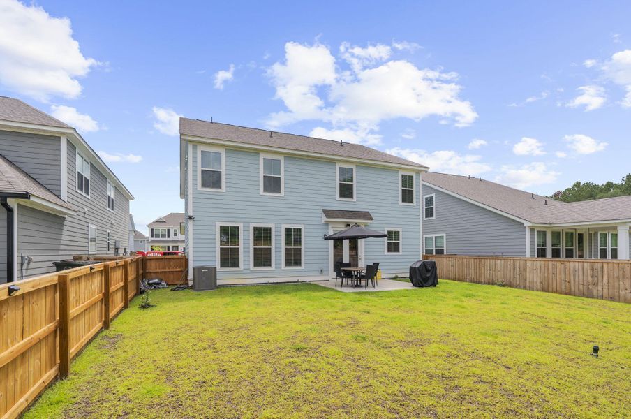 Exterior details and patio area of a home in High Point at Foxbank, Moncks Corner (Image 27).